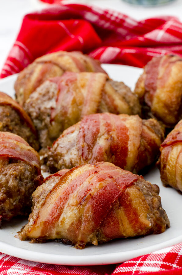 Bacon wrapped meatloaf on a serving platter.
