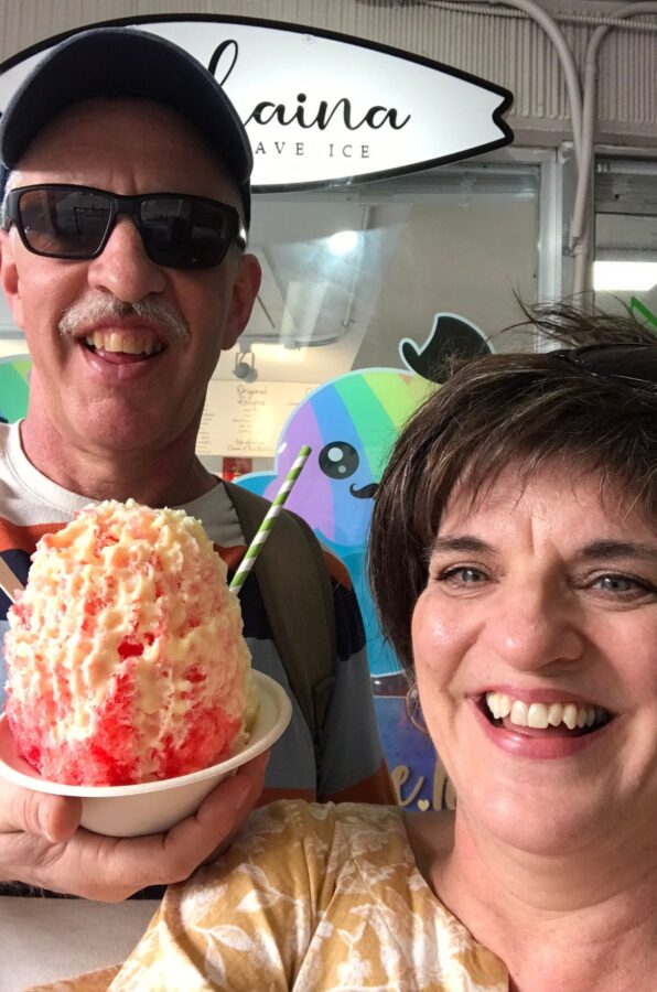 A couple holding a bowl of shave ice in waikiki