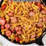 A cast iron skillet with mennonite farmer's sausage and noodles with cream gravy in it