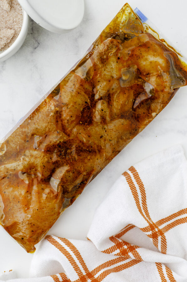 a ziploc bag with mexican chicken breast marinade and chicken breasts in it.