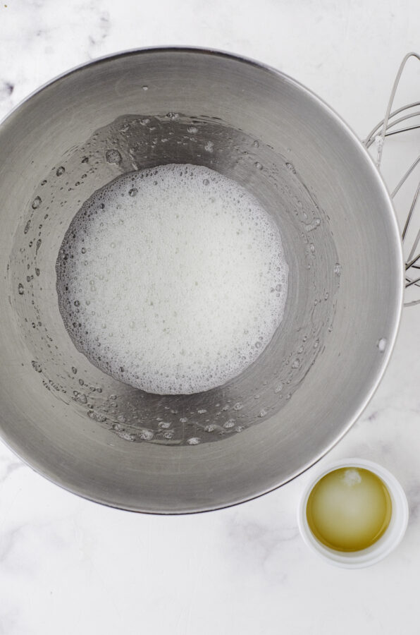 Frothy eggs as the first step to beating eggs for this pavlova recipe.