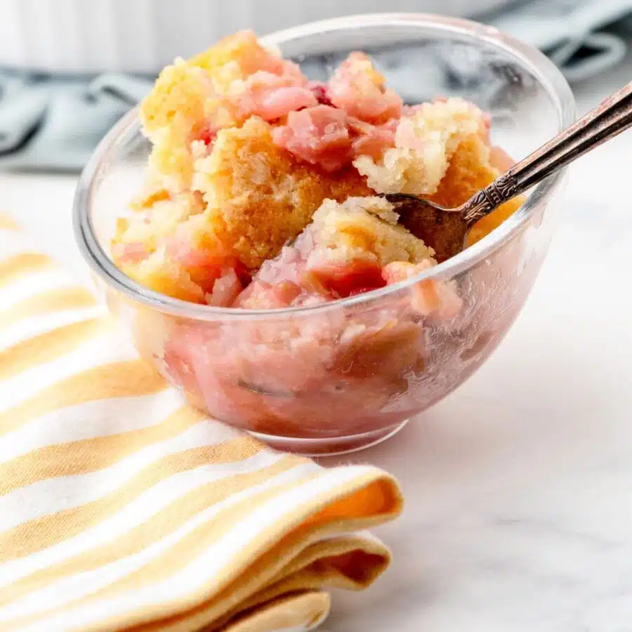 a bowl of baked sticky rhubarb pudding cake