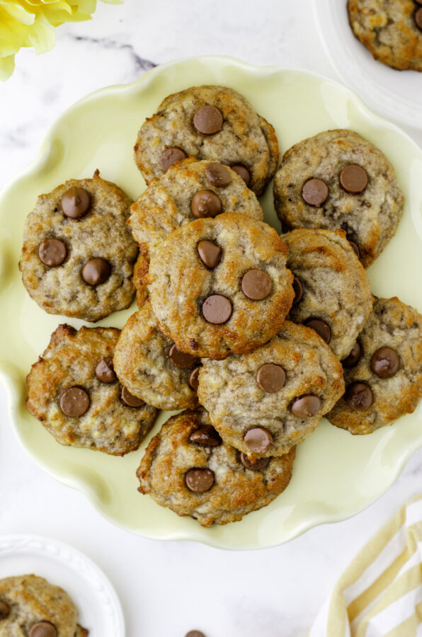 Banana Bread cookies with chocolate chips on a yellow platter.