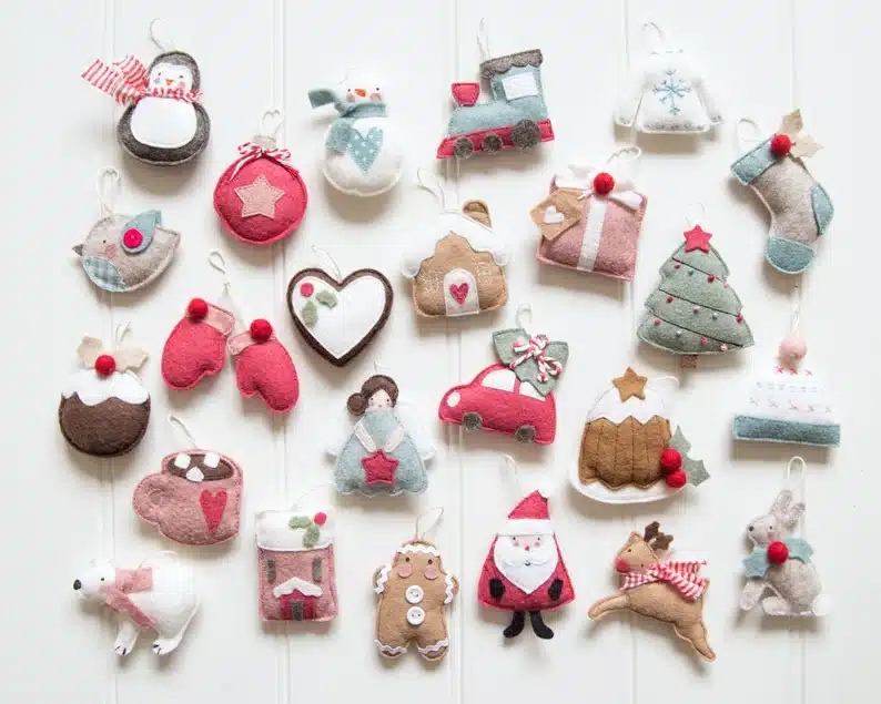 A set of felt Christmas ornaments in a bunch of different Winter Wonderland themed shapes