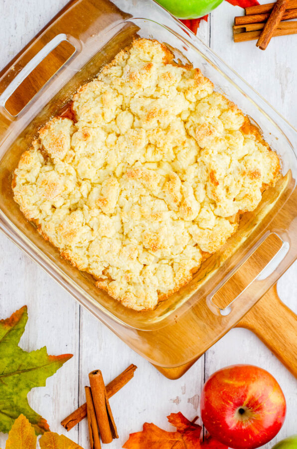 A pan of old fashioned apple cobbler right after it has been taken out of the oven.