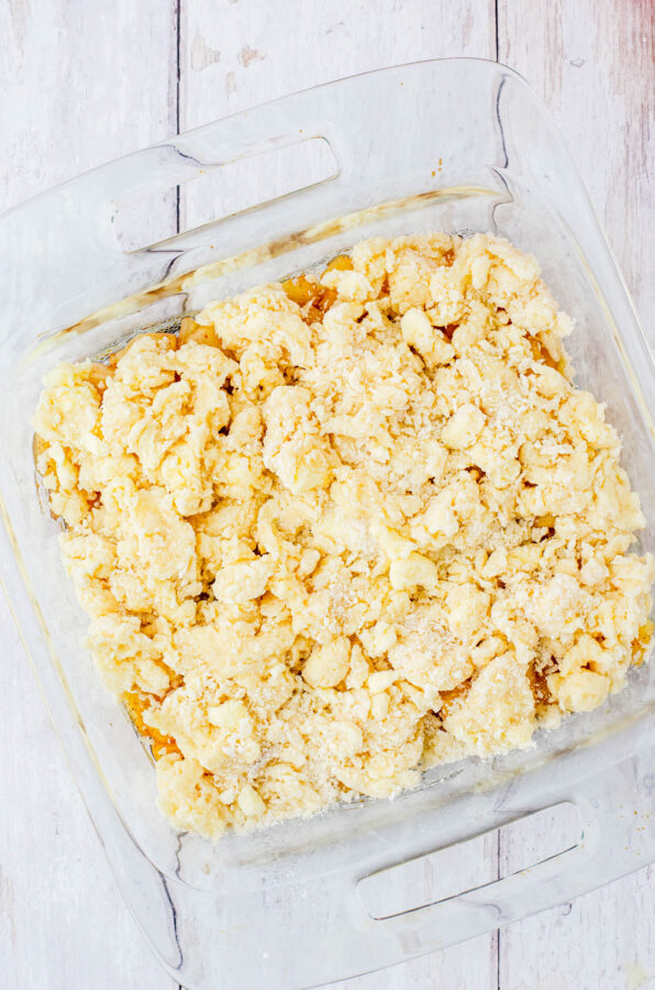 A pan of apple cobbler ready to be put in the oven to bake.