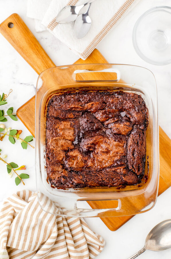 A pan of hot fudge pudding cake sitting on a table ready to be served