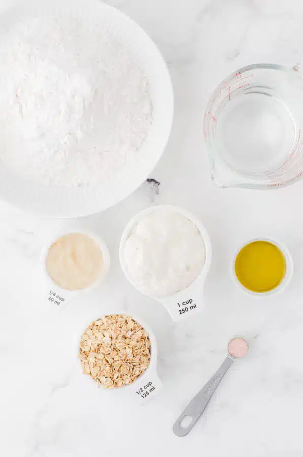 Ingredients for honey oat sourdough sandwich bread