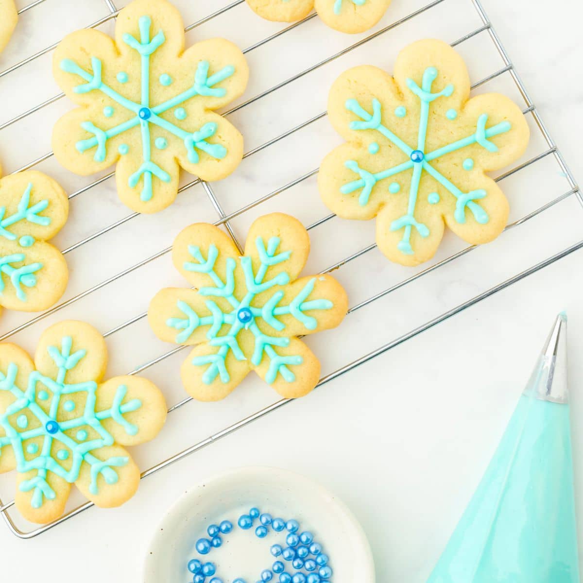 snowflake sugar cookies with aqua blue frosting