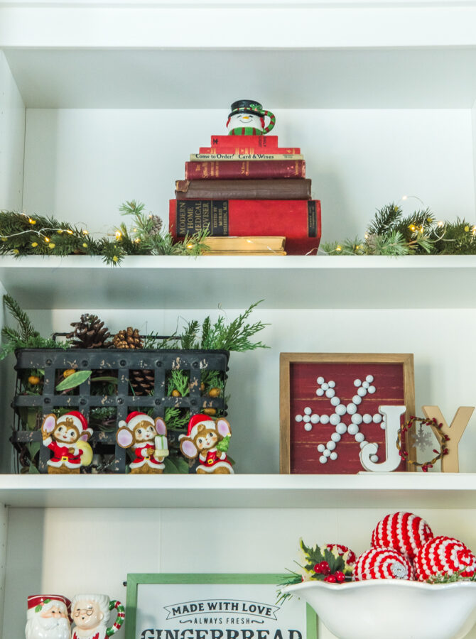 Books stacked up to look like a Christmas tree in a bookshelf
