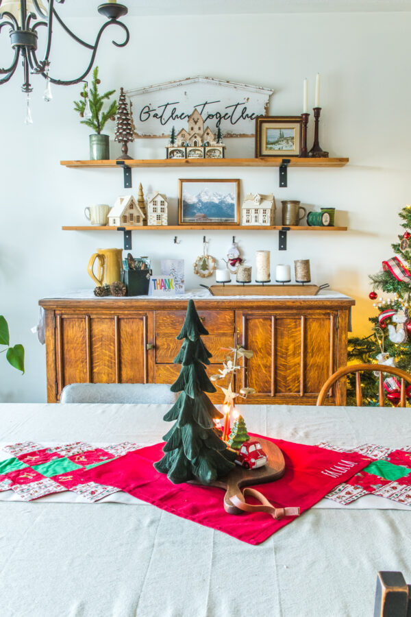 Antique buffet with shelves above with decorations for Christmas
