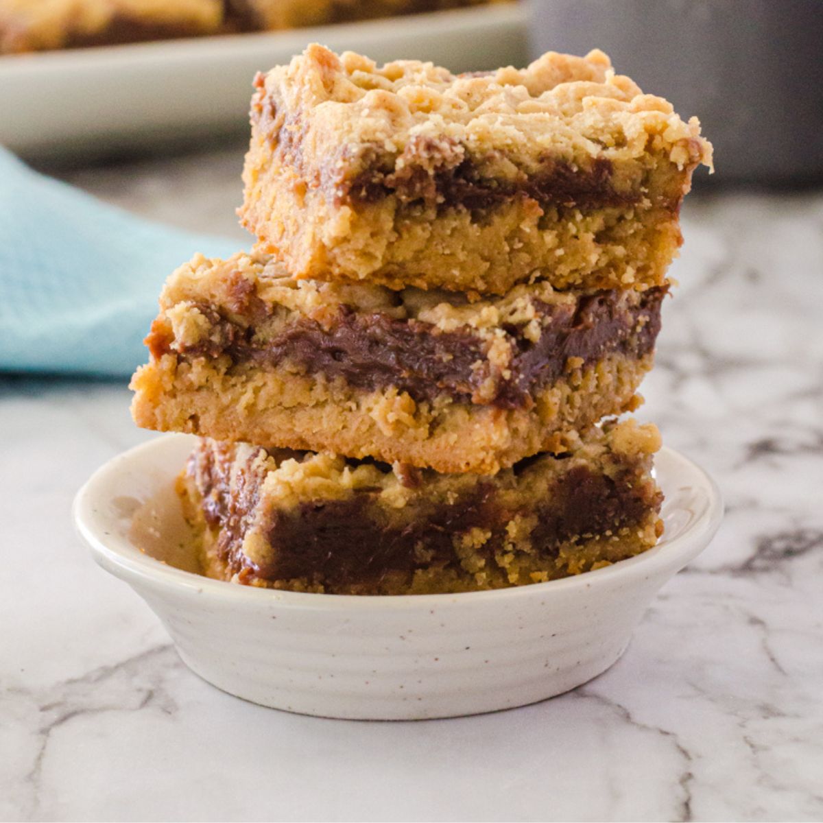 peanut butter fudge bars stacked up