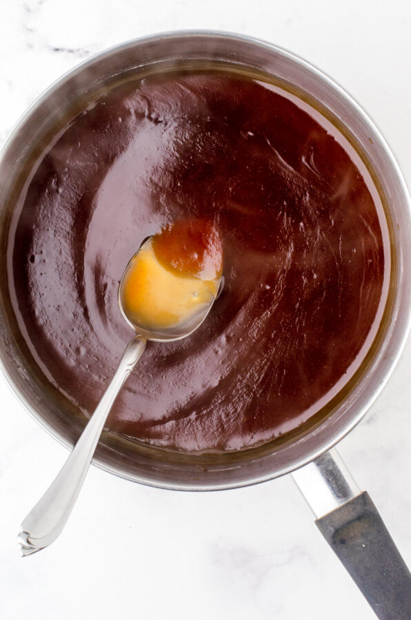 Cook over medium high heat until the sauce darkens and becomes thick