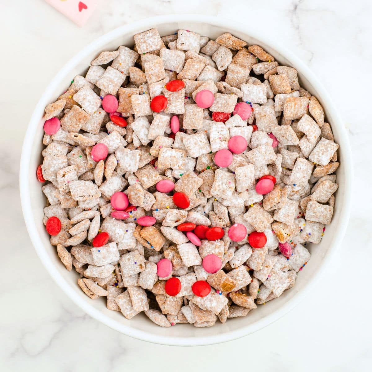 Bowl of chex mix puppy chow snack mix