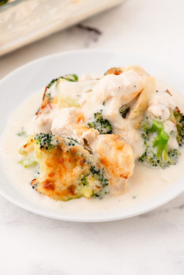 A serving of broccoli chicken alfredo on a plate.