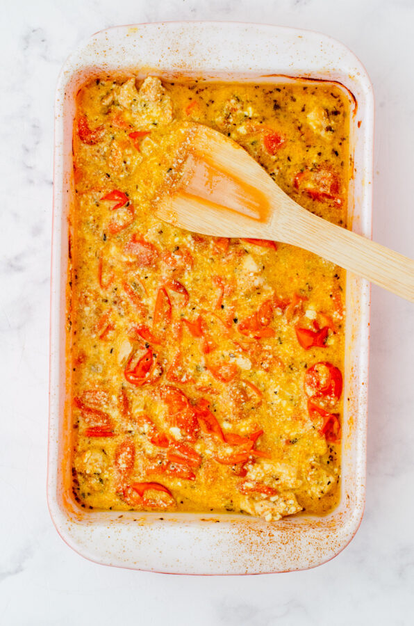 feta chicken pasta after it has been baked and stirred into a creamy sauce.