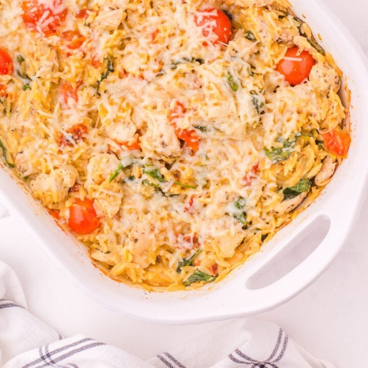 A pan of Tuscan Chicken Casserole with orzo pasta