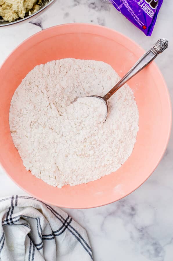 Dry ingredients for oatmeal chocolate chip cookies stirred together.