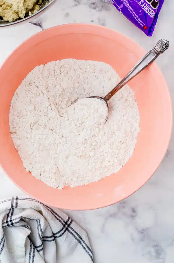 Dry ingredients for oatmeal chocolate chip cookies stirred together.
