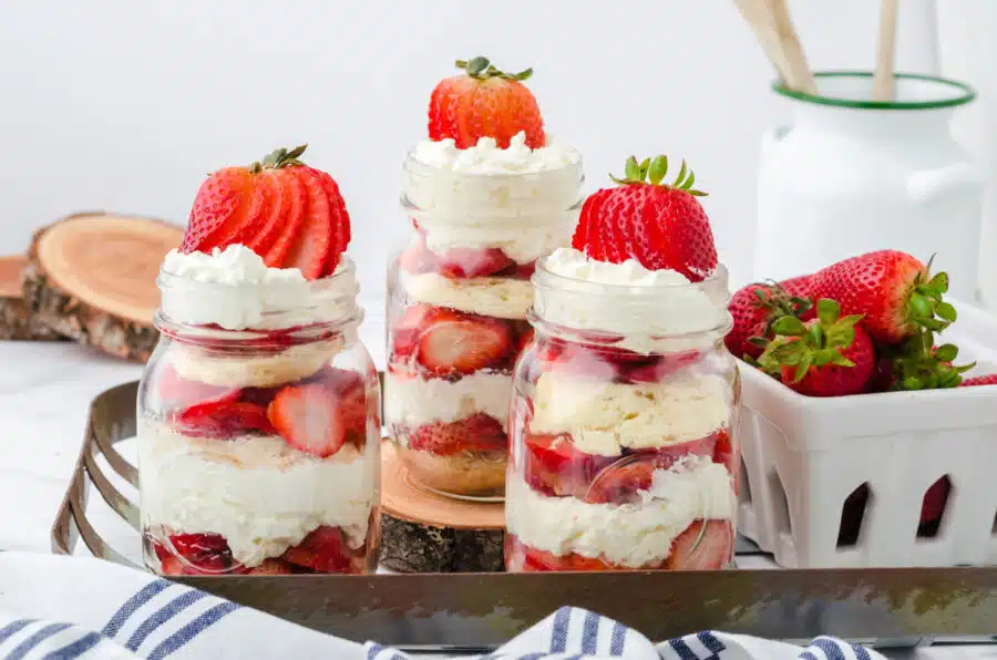 Mason jar strawberry shortcakes on a tray