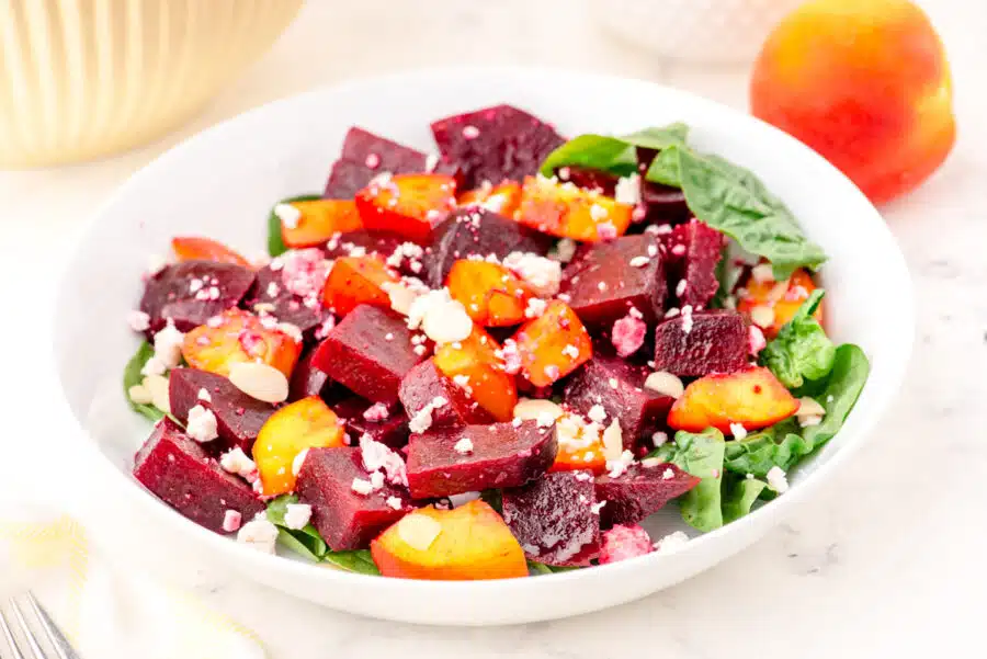 A bowl of beet and peach salad