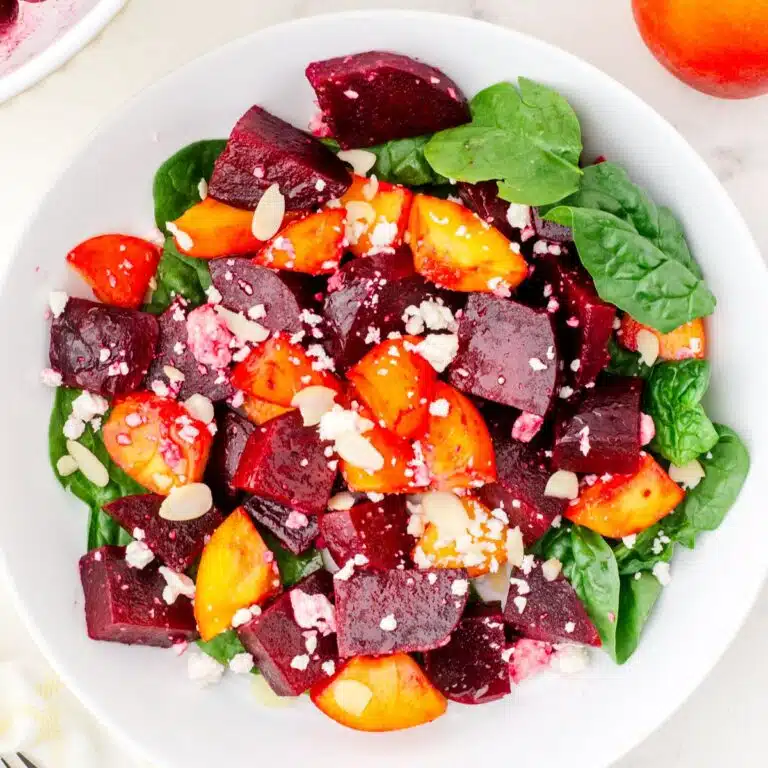 a bowl of beet and peach salad