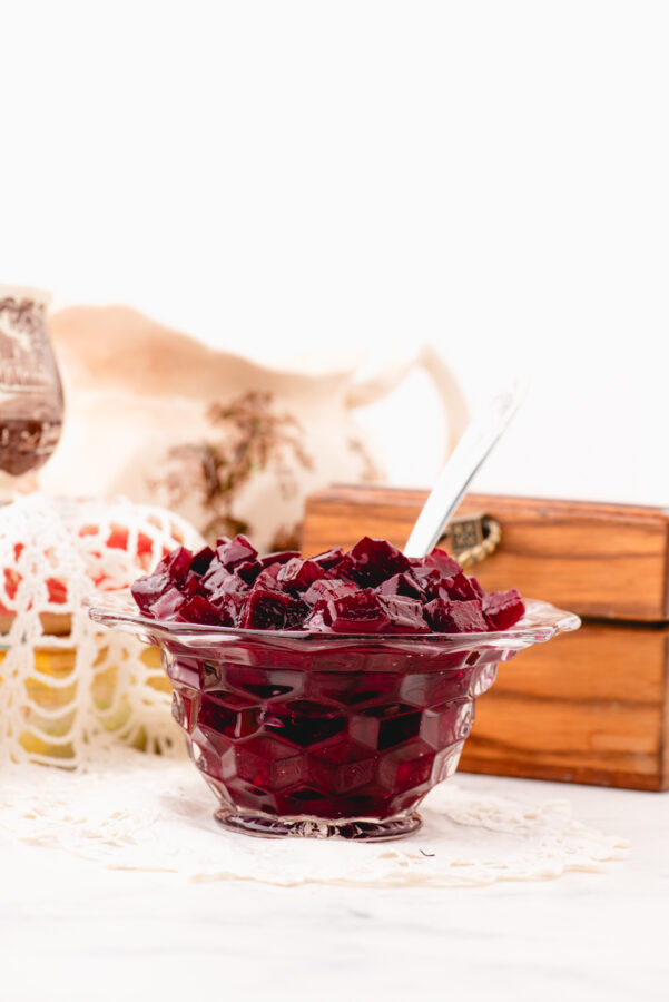 easy Harvard Beets in a serving bowl in front of an antique recipe card file