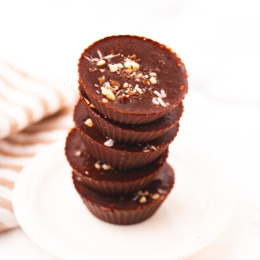 Almond butter chocolate cups stacked up