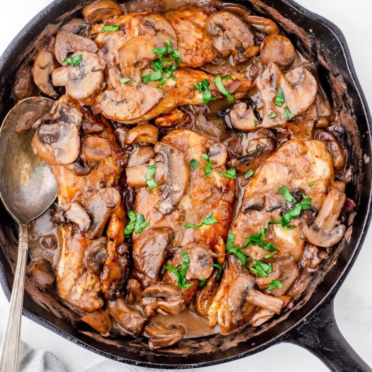 A skillet of chicken marsala ready to serve