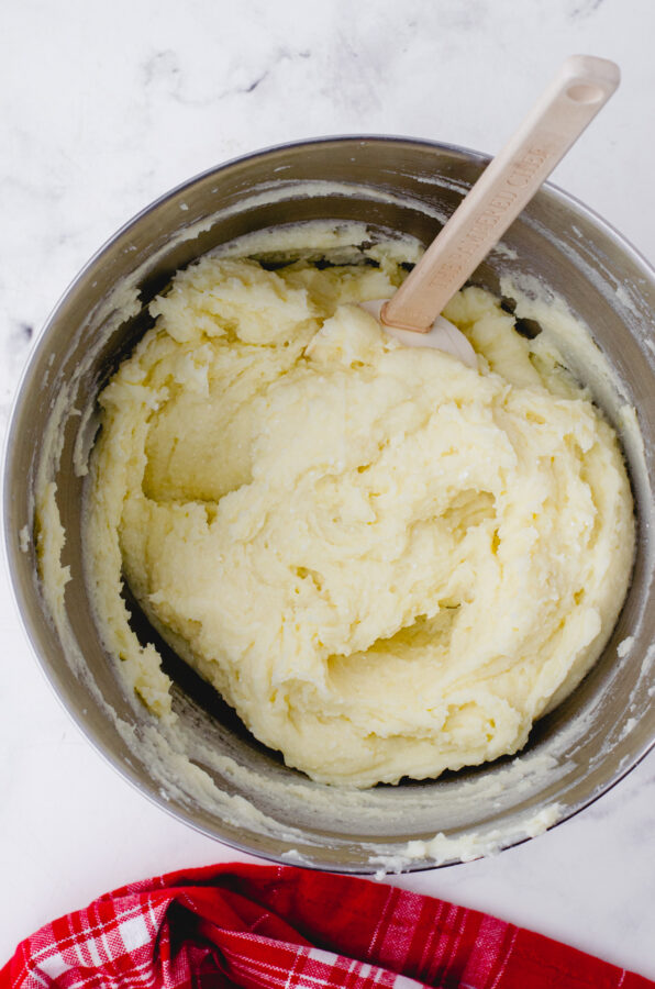 Whipped mashed potatoes in a mixing bowl