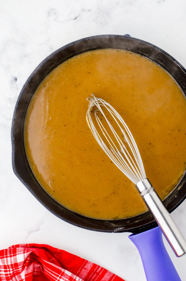 Turkey pan gravy in a cast iron skillet