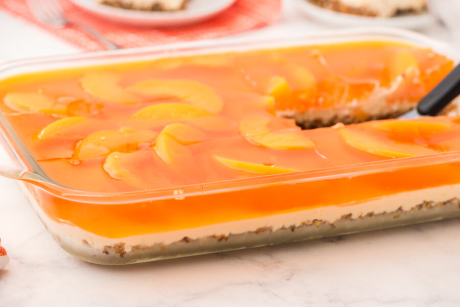 A pan of peach pretzel salad.