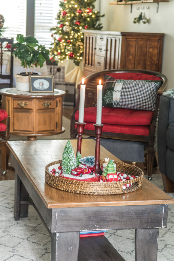 Christmas coffee table decor with a red chair behind
