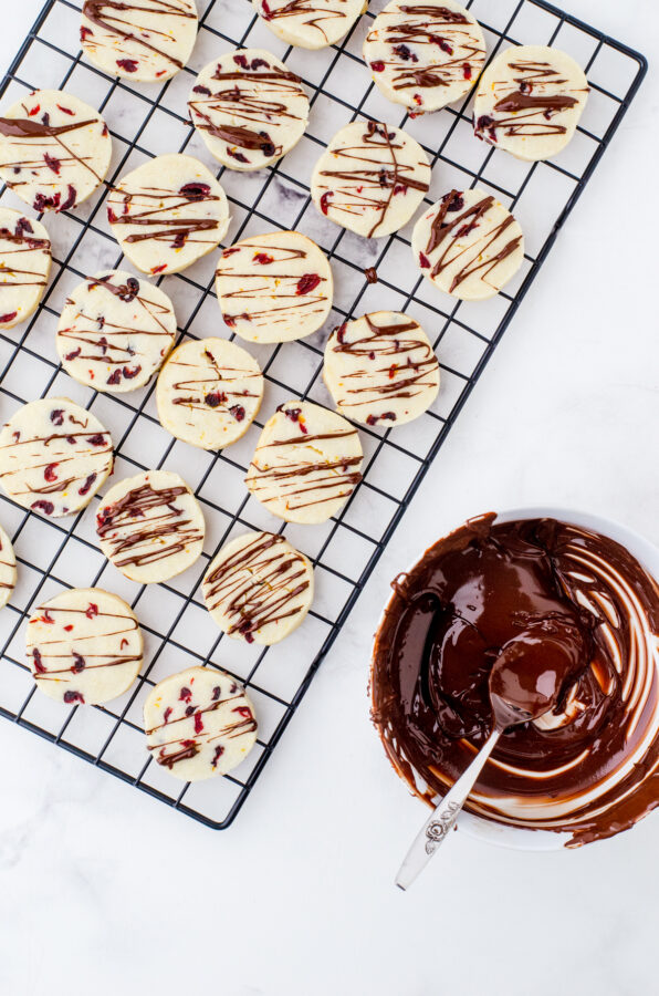 whipped shortbread cookies with chocolate drizzle over the top