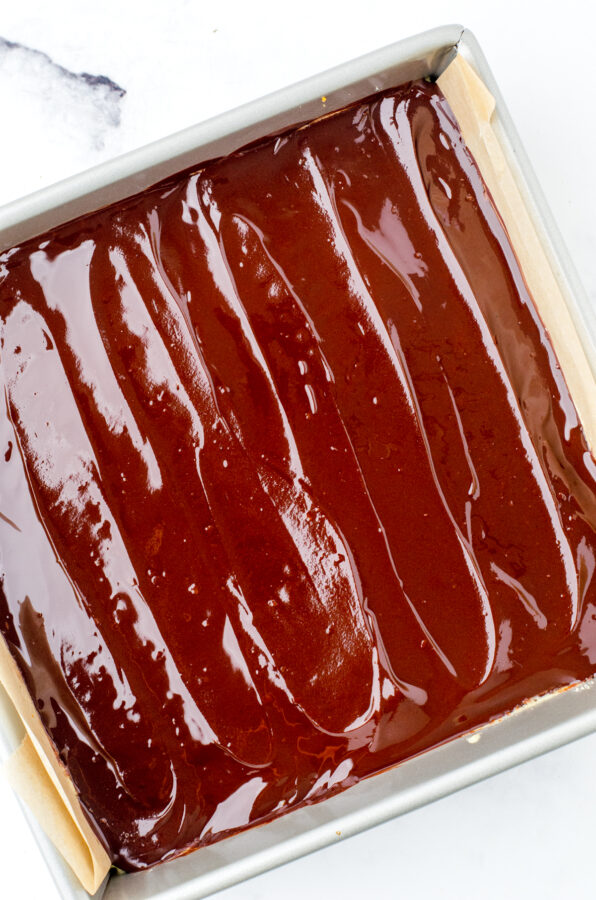 Chocolate spread on top of nanaimo bar layers